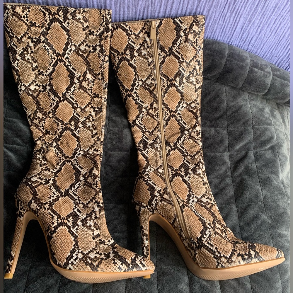Snake print knee high boots